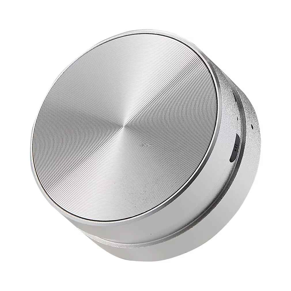 Silver portable speaker with white background 